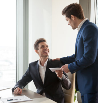man smiling receiving letter