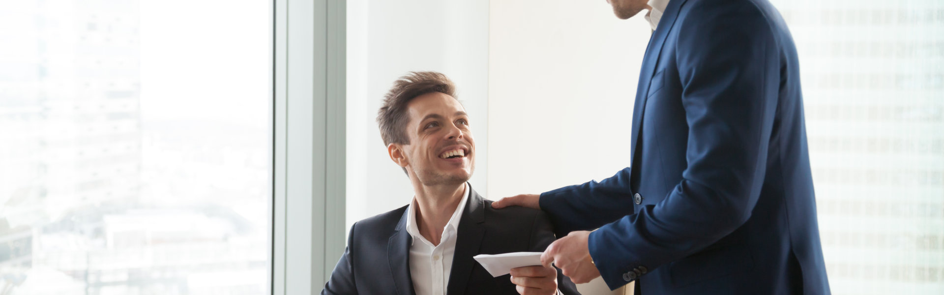 man smiling receiving letter