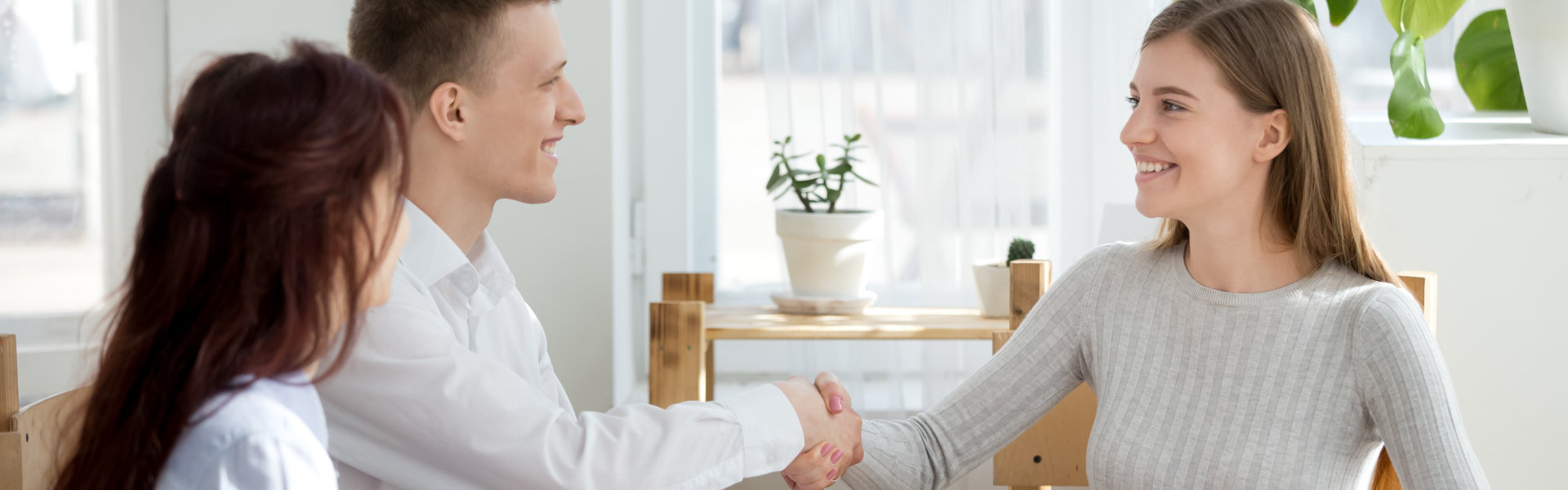 man and woman shaking hands